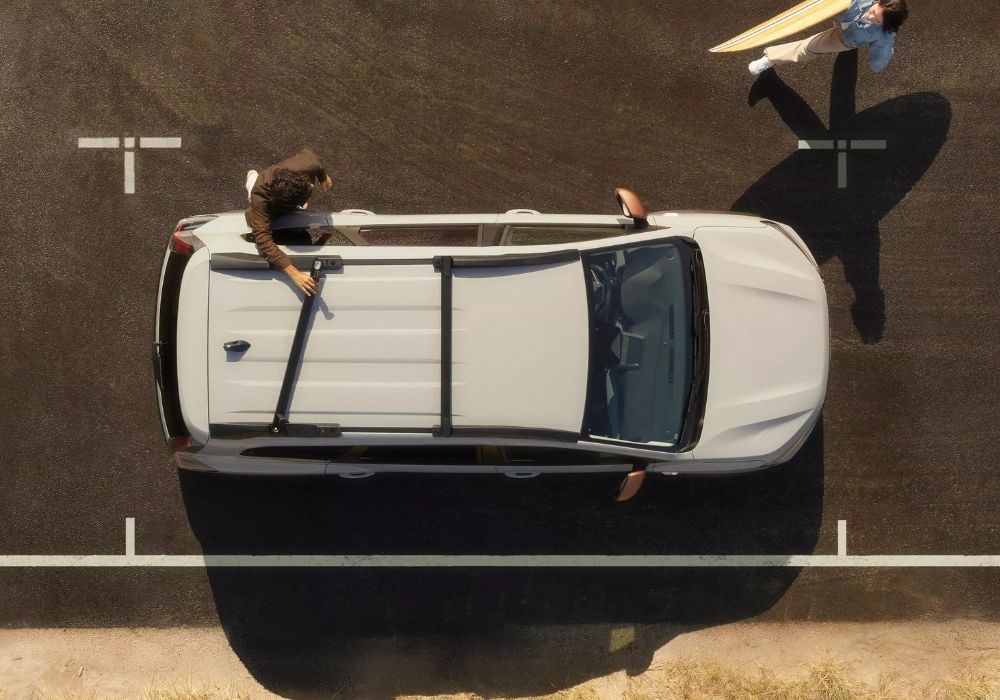 Dacia Jogger viewed from above with roof rails in use, showing practical storage solutions and outdoor lifestyle.