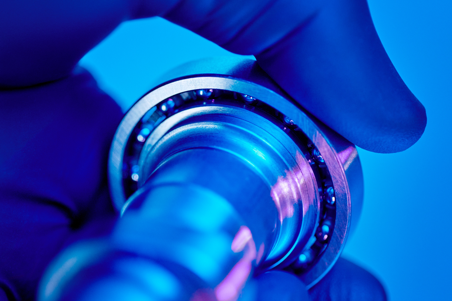 Close-up of precision bearing component during mechanical inspection.