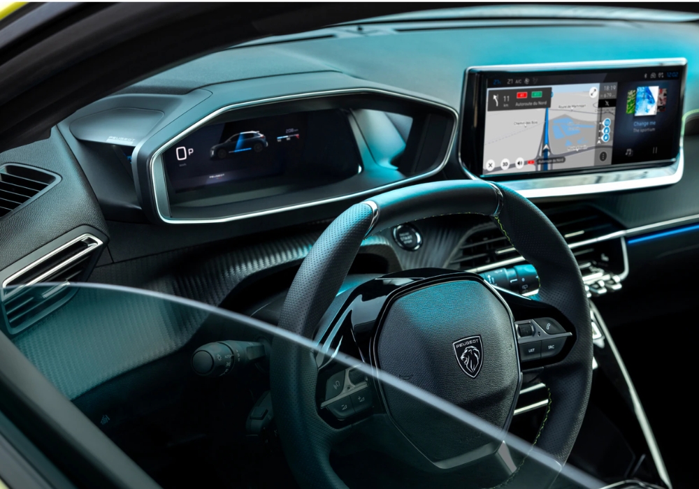 Peugeot 208 interior with digital driver display, steering wheel and touchscreen navigation system.