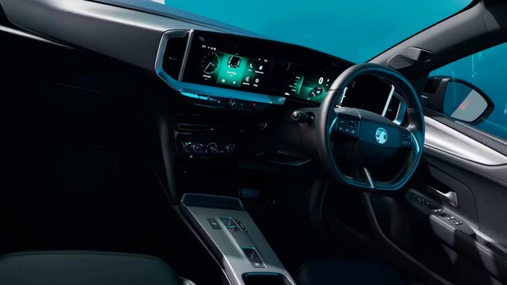 Vauxhall Mokka interior showing the steering wheel, dashboard display and centre console.