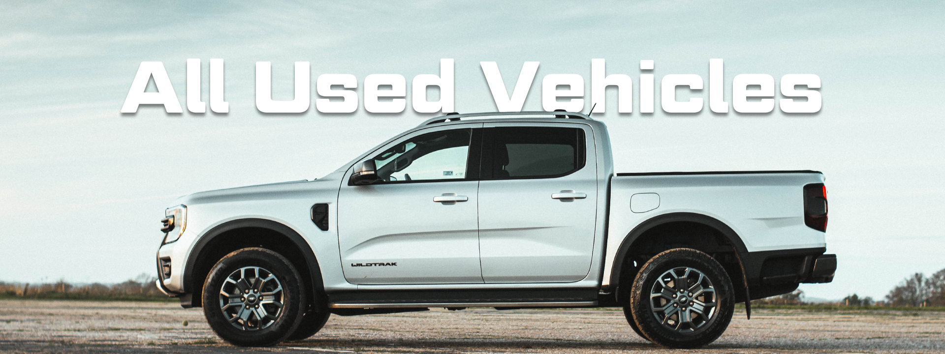 side profile of Ford Wildtrak. Text overlaid reading "All Used Vehicles"