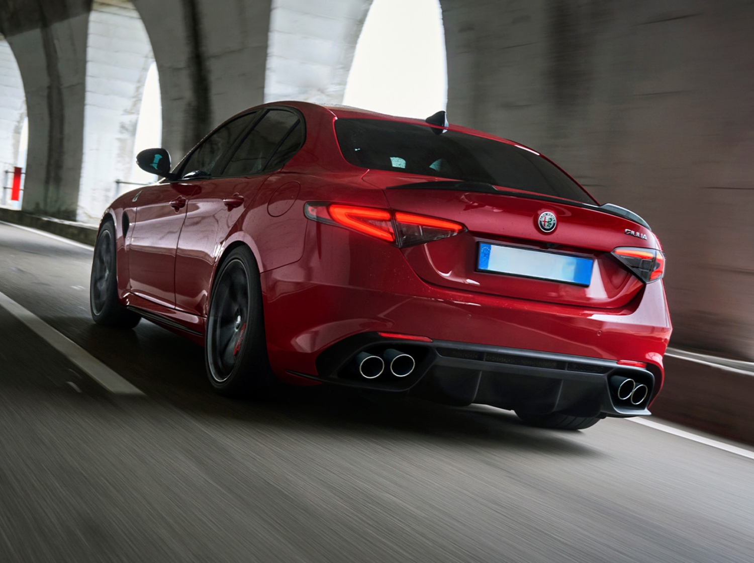 Giulia Quadrifoglio driving shot rear view