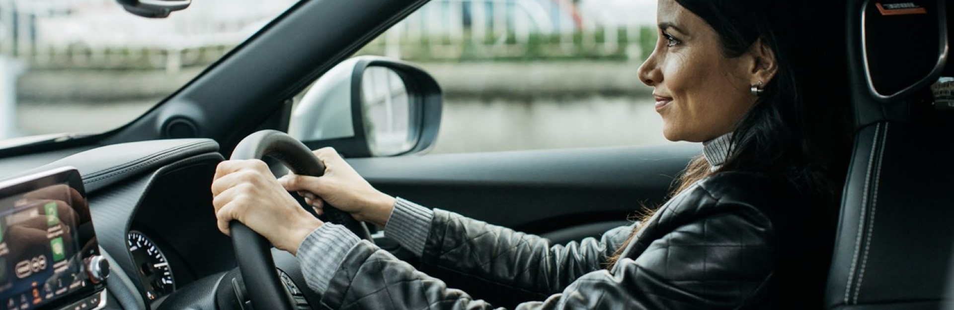 Women driving a Nissan - confident 