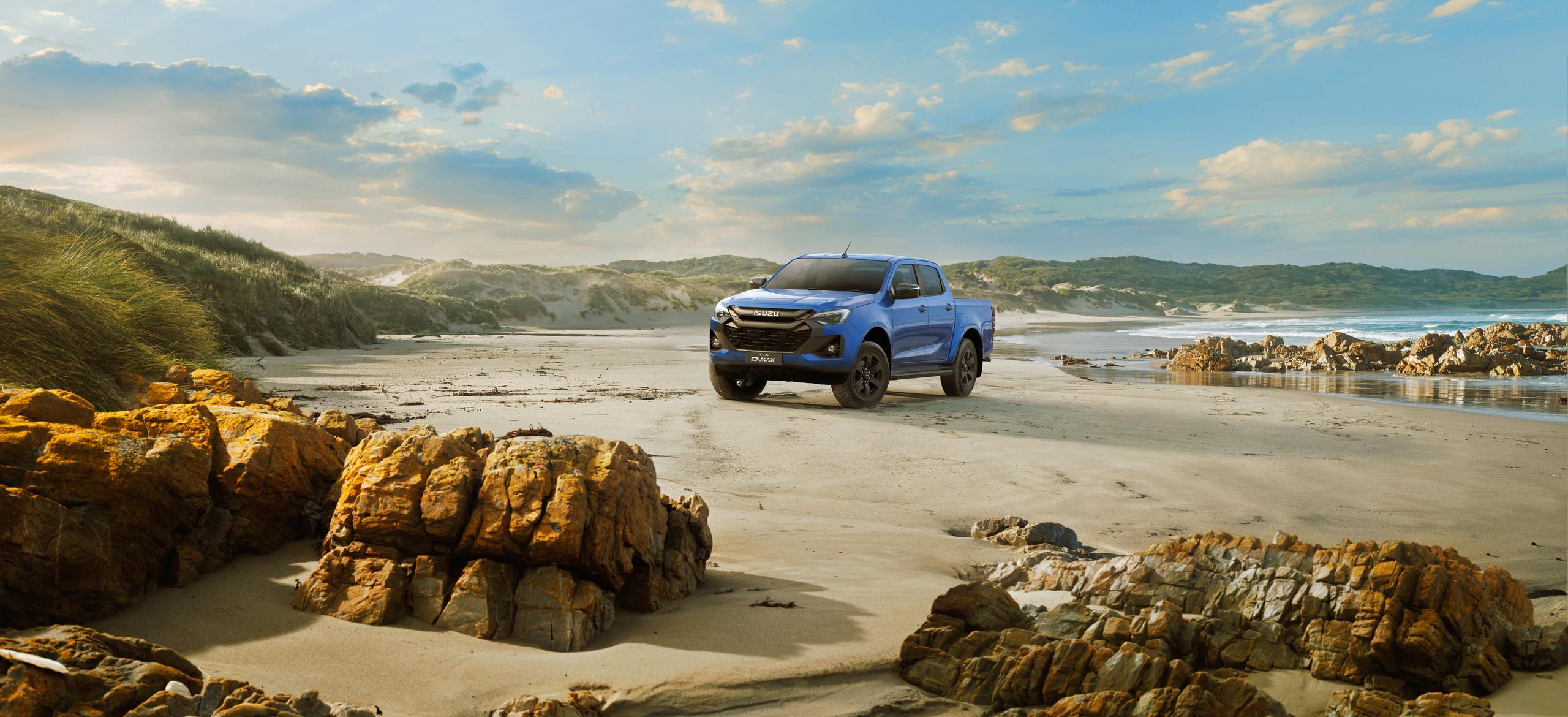 blue range rover evoque by the waters