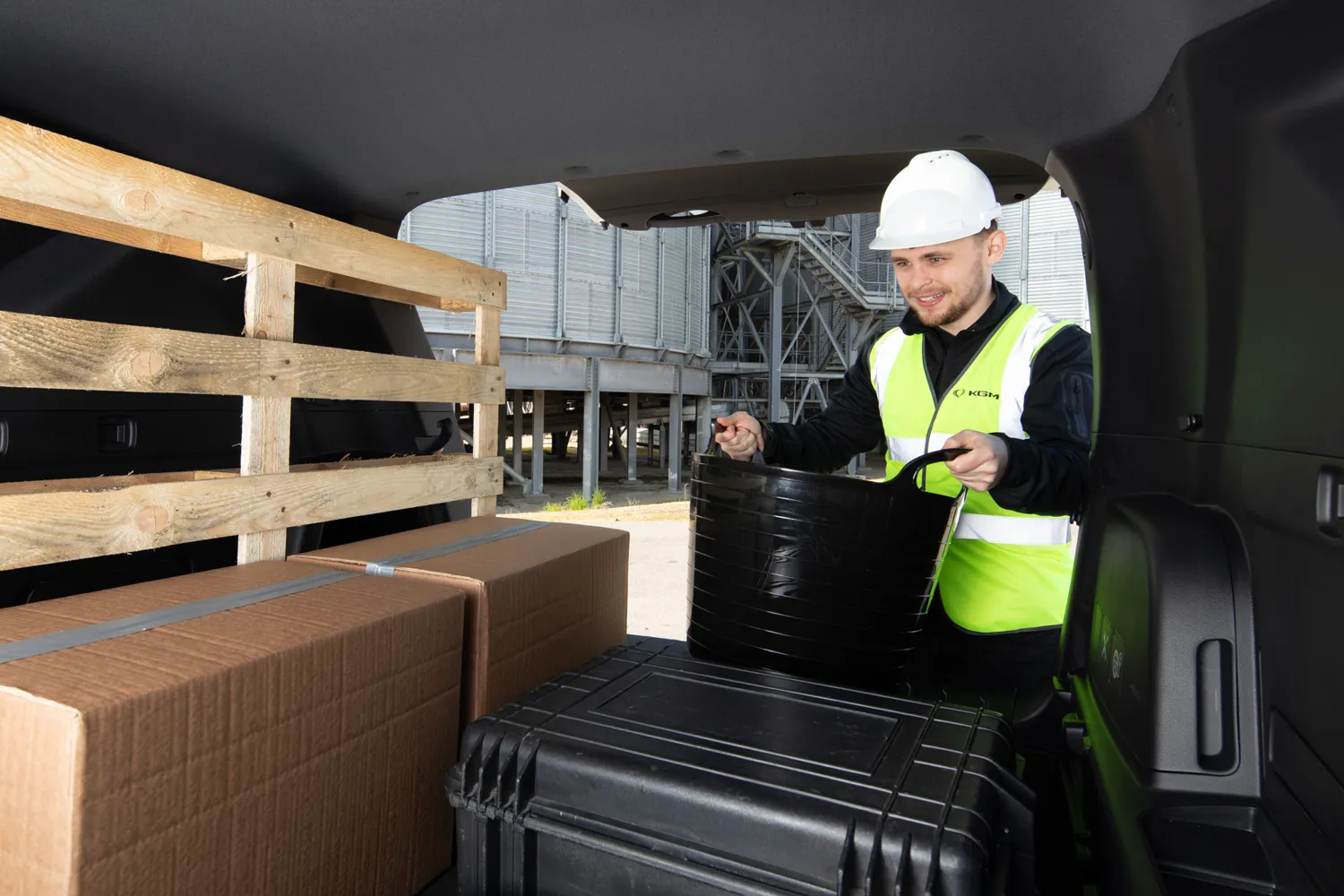 workman putting bits in the back of his Rexton commercial