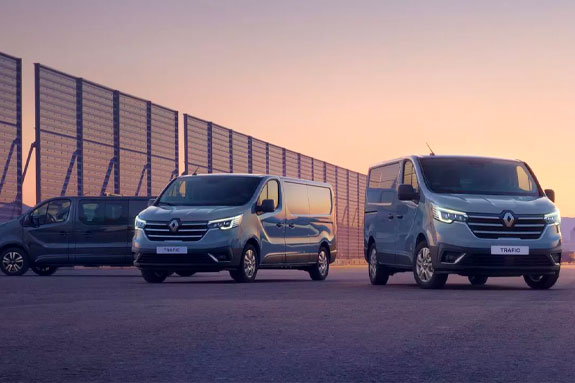three Renault Traffic's in sunset