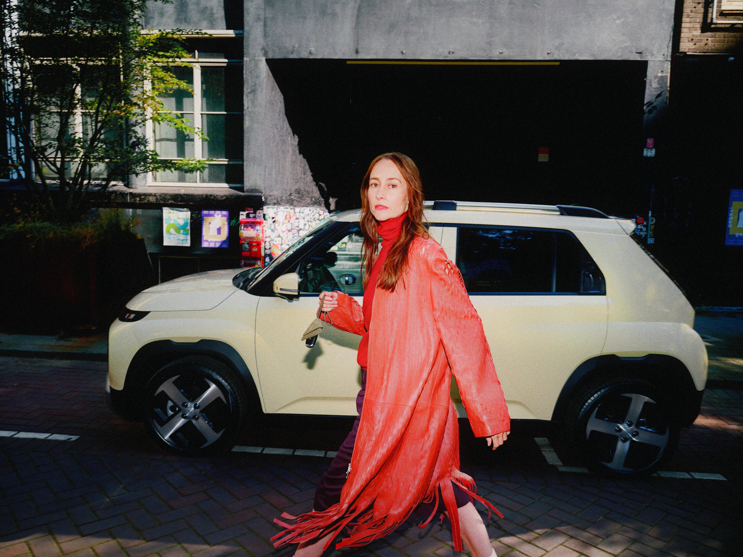 woman in red by an inster