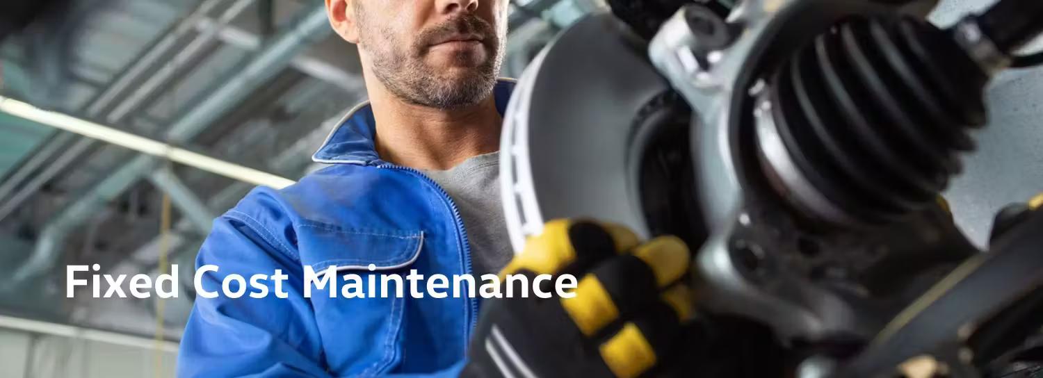Volkswagen Mechanic Inspecting Brake Disc