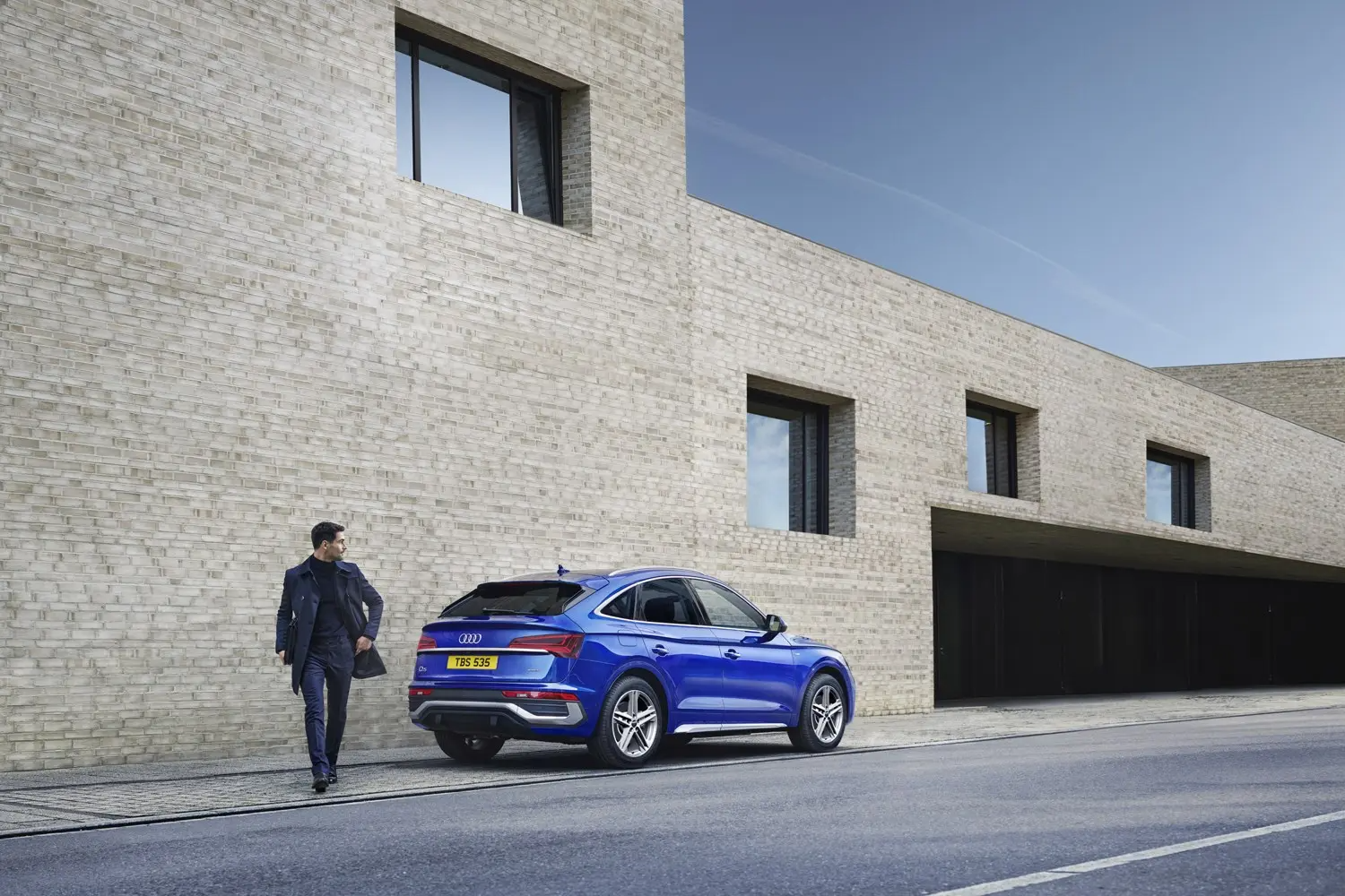 Blue Audi SUV Rear Side View