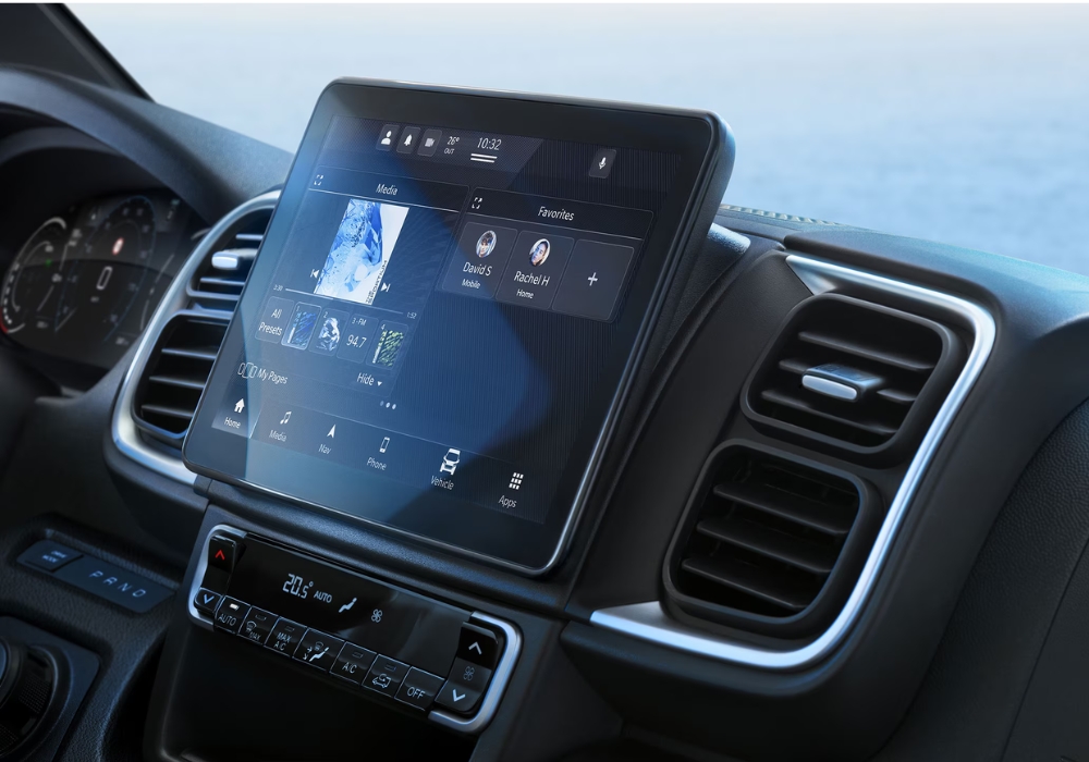 Peugeot e-Boxer touchscreen displaying media interface and connected services on the dashboard.