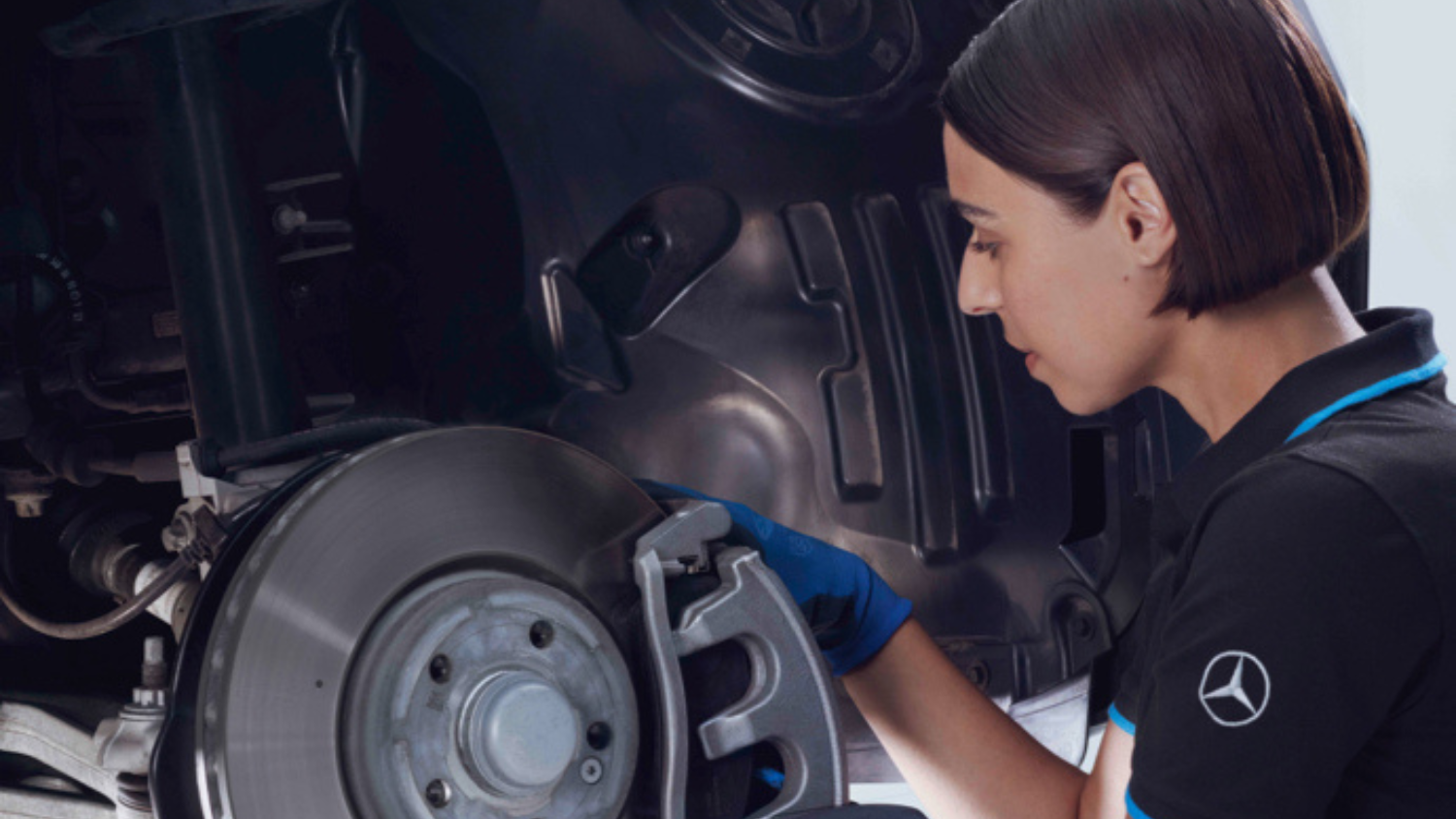 Mercedes-Benz Mechanic Inspecting Brake Disc