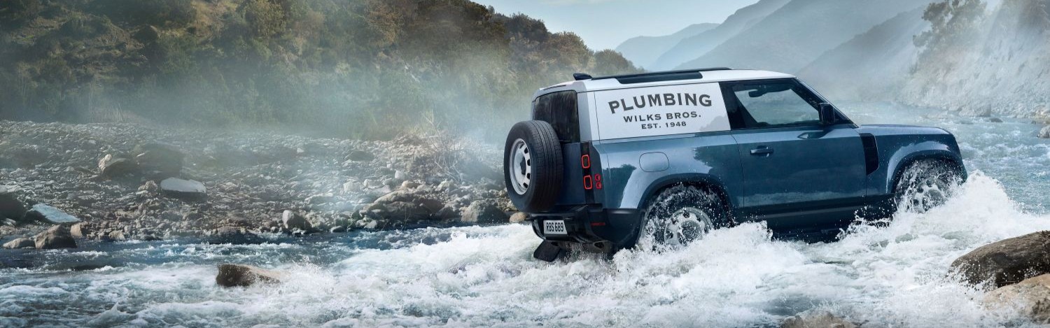 Land Rover Driving In A Stream