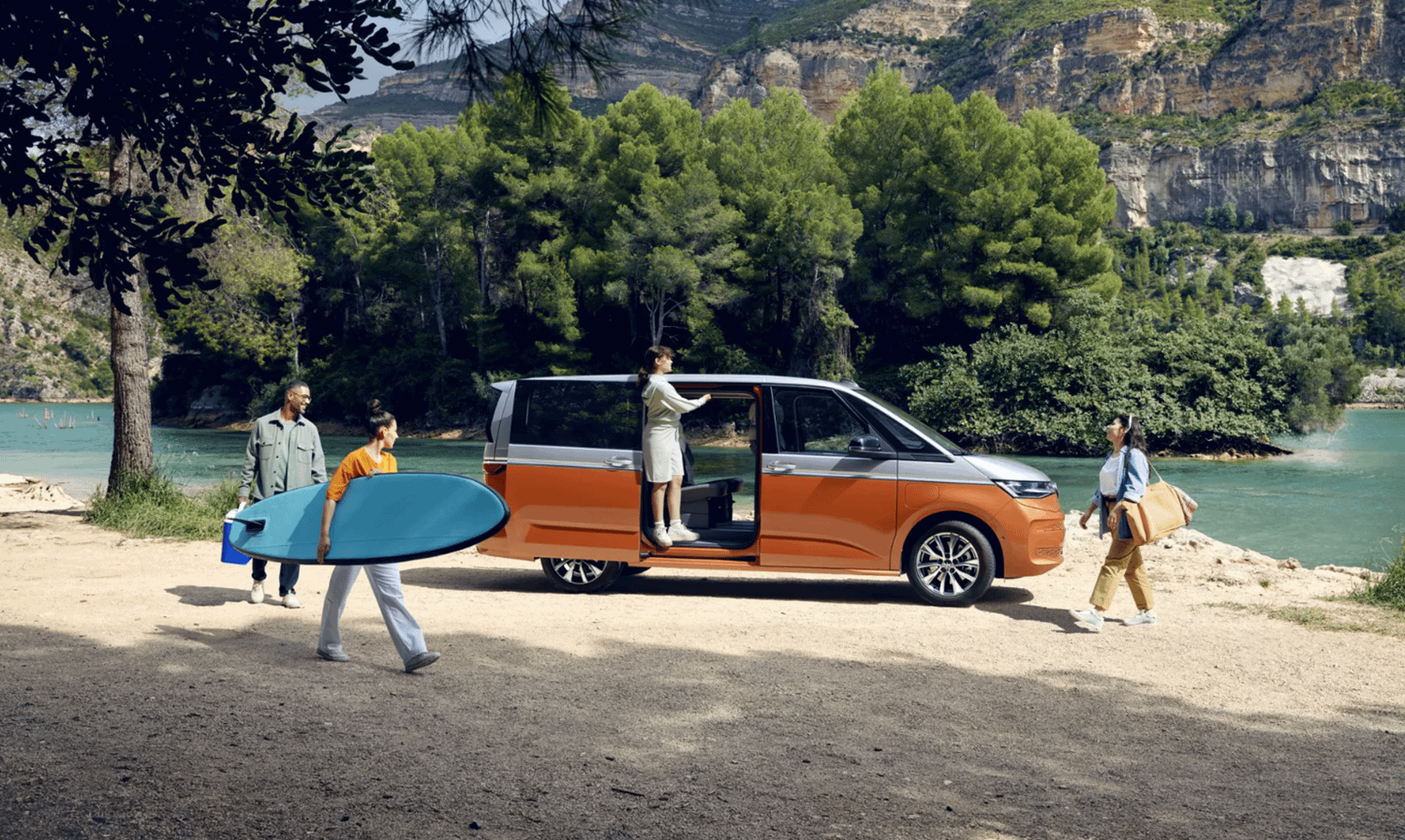 Orange and White New Volkswagen Multivan by lake