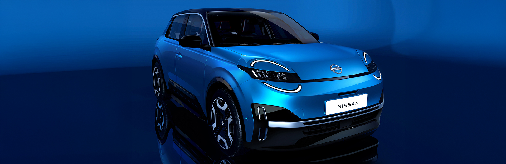 Front view of the new blue electric nissan micra with a blue background.