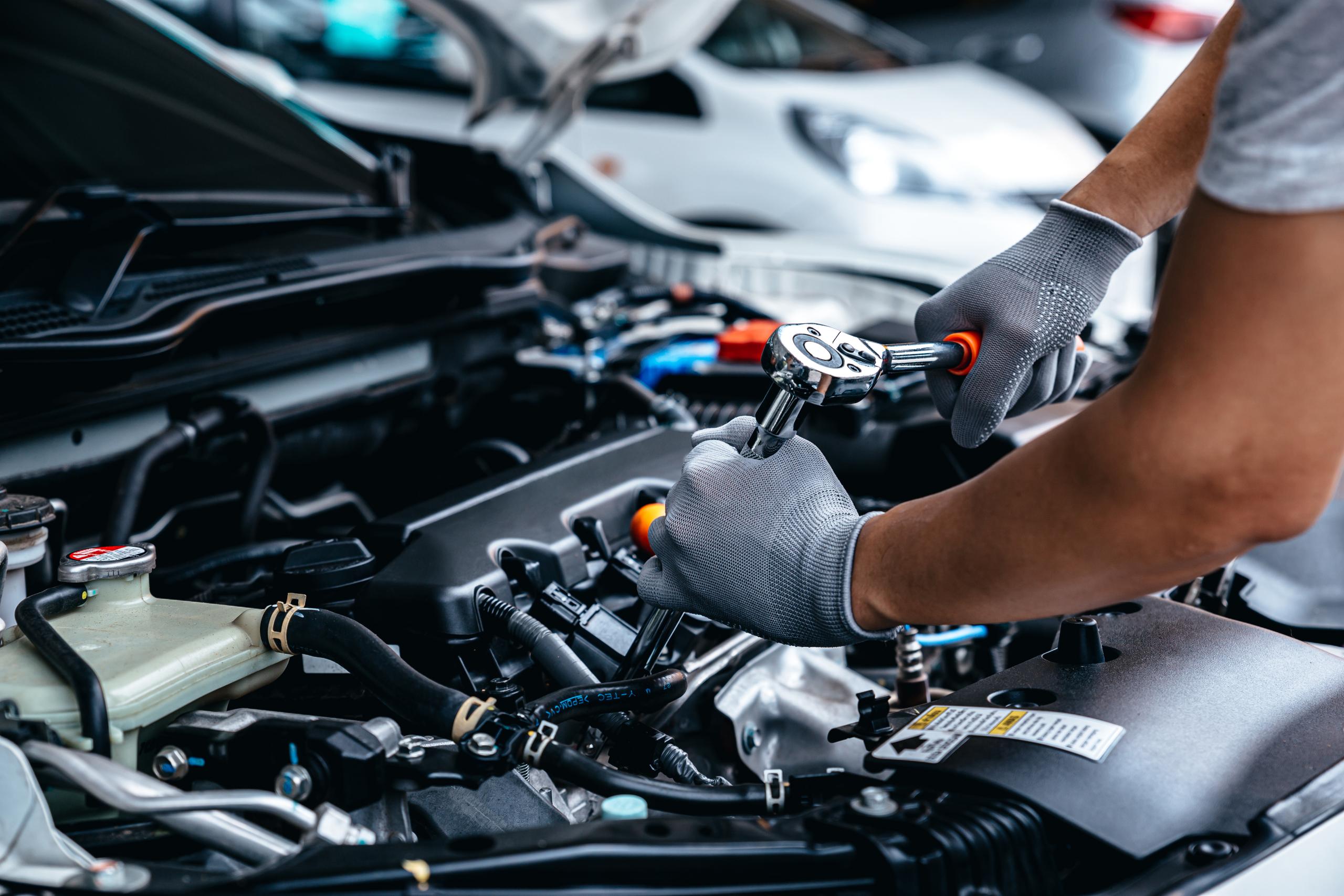 Mechanic Working On Engine