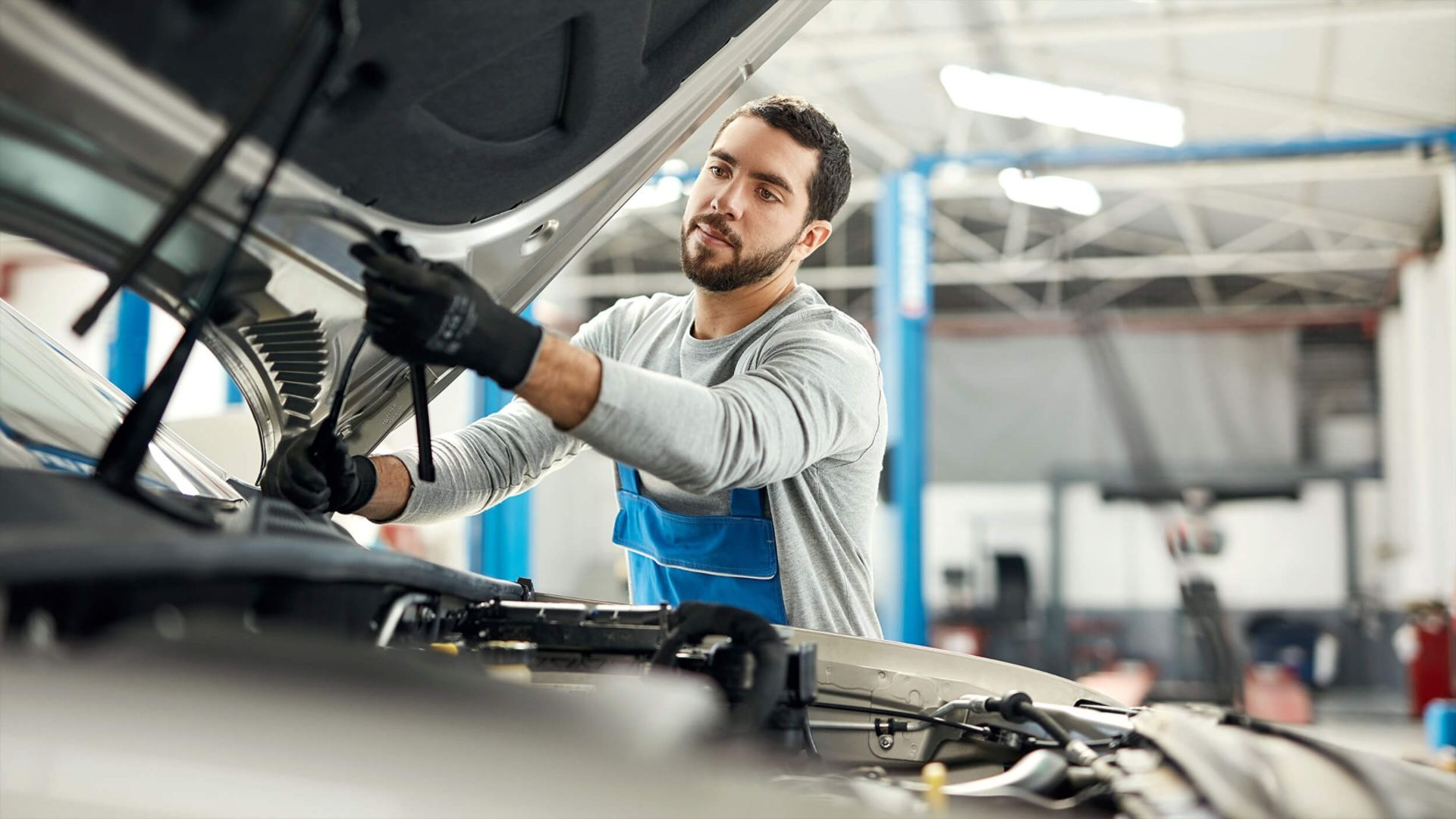 Volkswagen Mechanic working on VW Vehicle