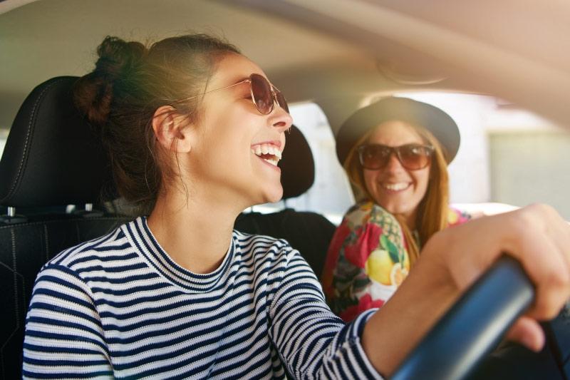 people laughing in car