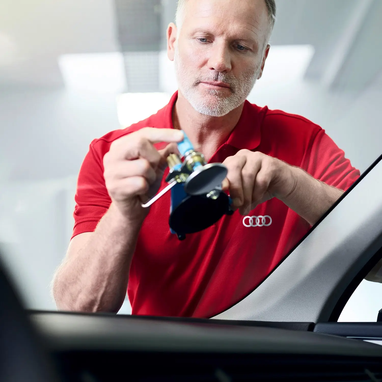 Audi Mechanic Working On Audi