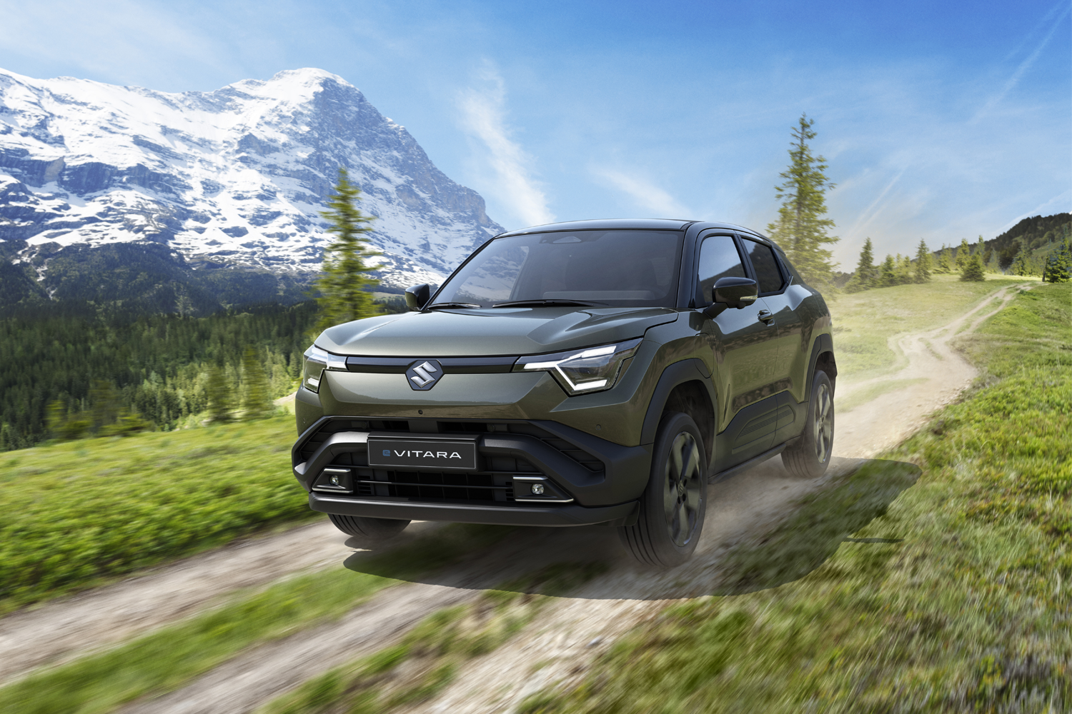 New e-VITARA driving by mountains