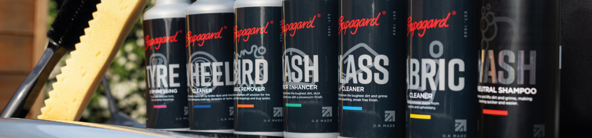 Supagard car care products lined up including tyre, glass, fabric and wash cleaners.