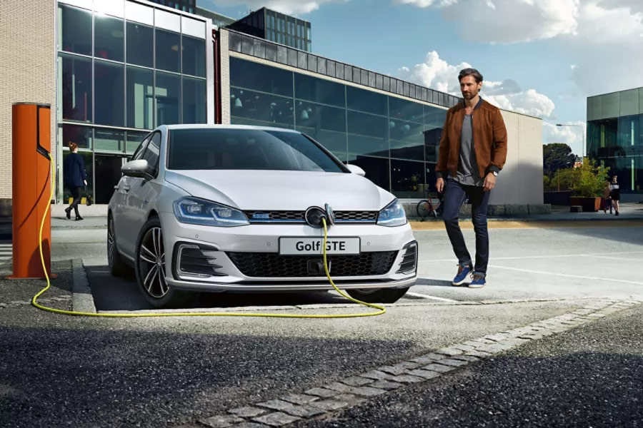 White Volkswagen Golf GTE On Charge