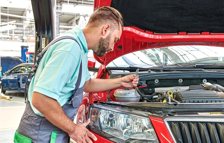 SKODA Mechanic Inspecting SKODA Vehicle
