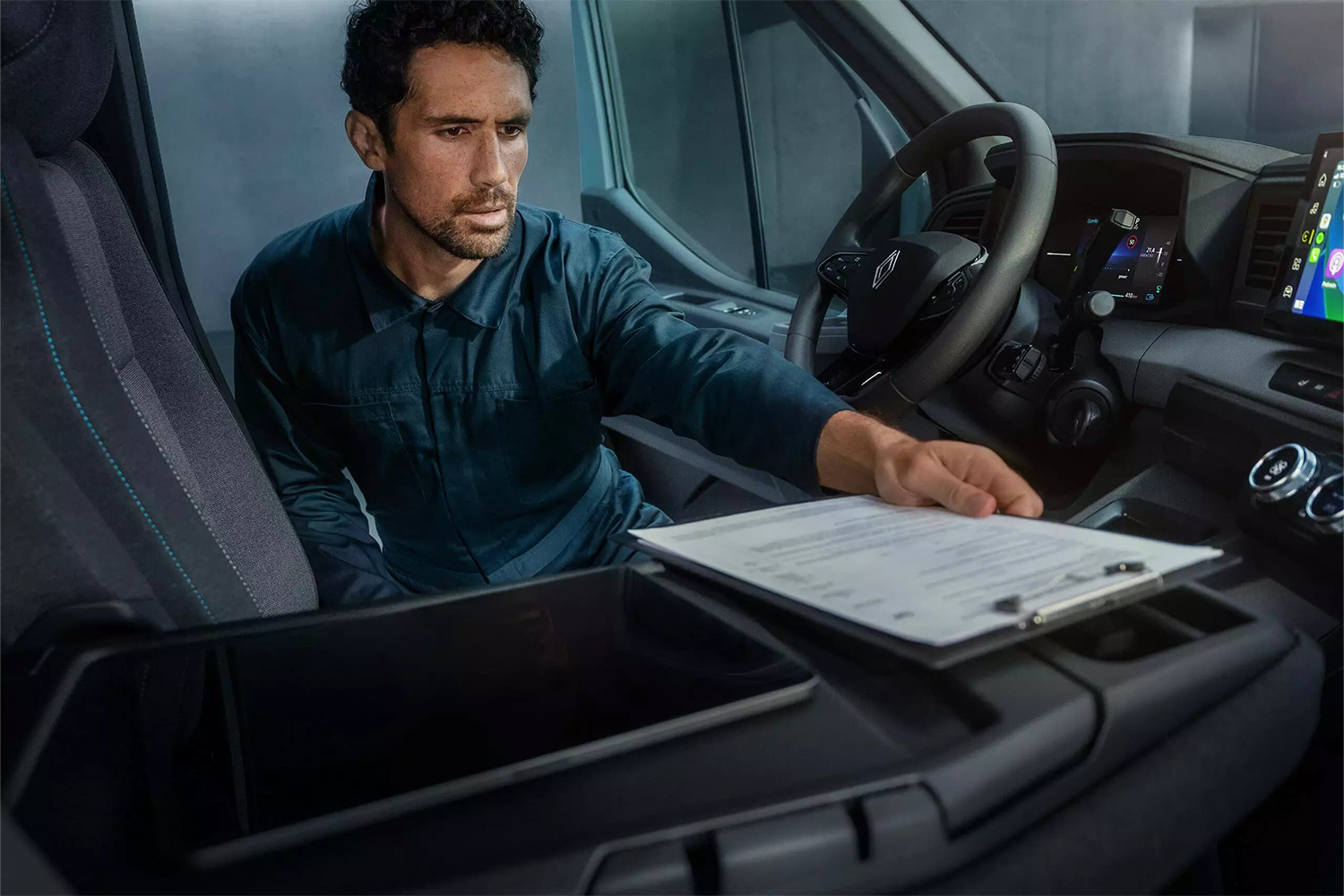 workman with clipboard in Master van