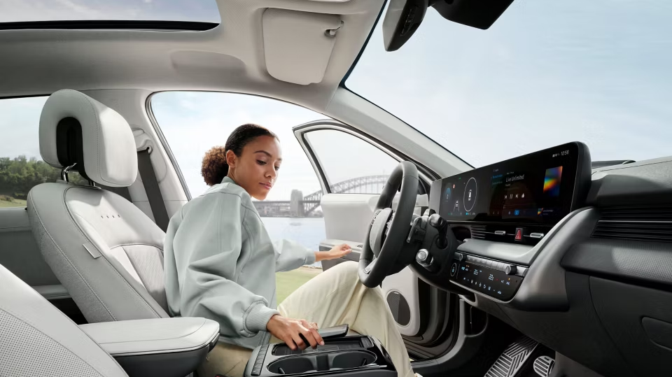 Lady entering an Hyundai EV