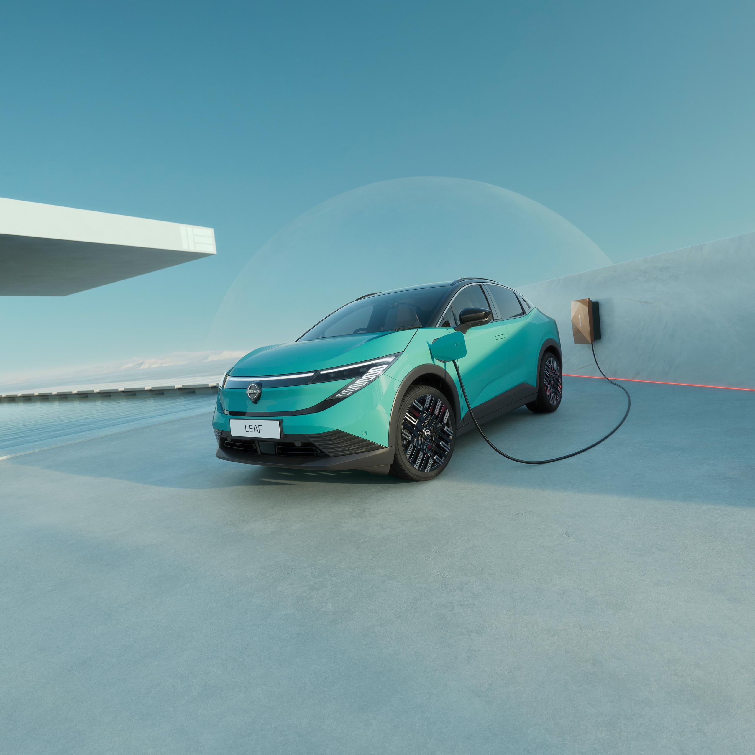Blue nissan leaf hero parked charging 