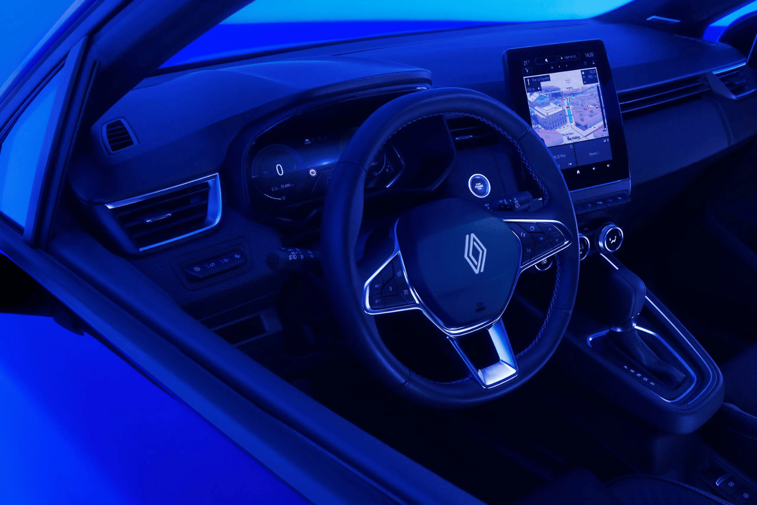 image from outside drivers window looking at steering wheel of Clio