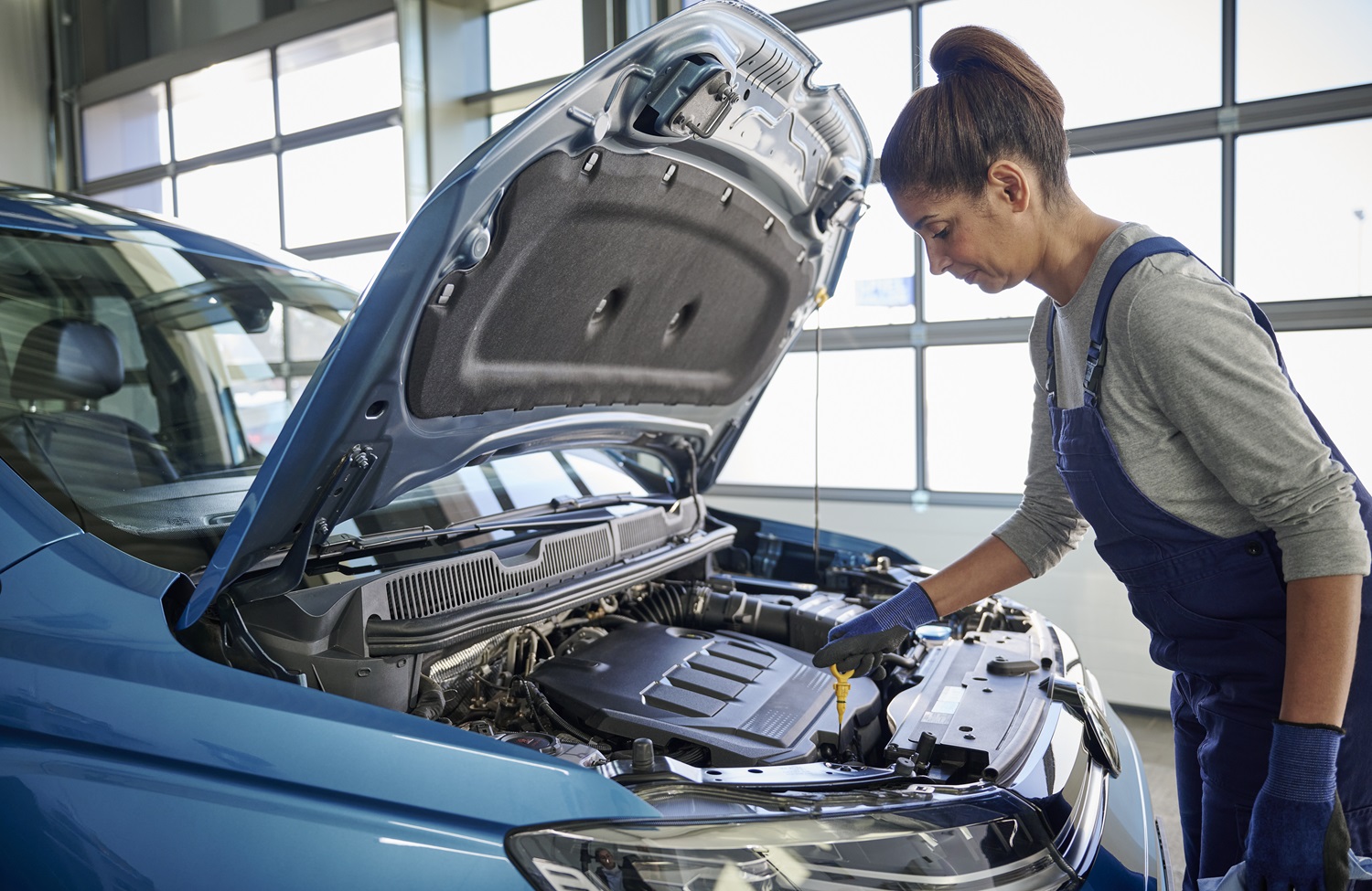 Volkswagen Mechanic Inspecting Engine