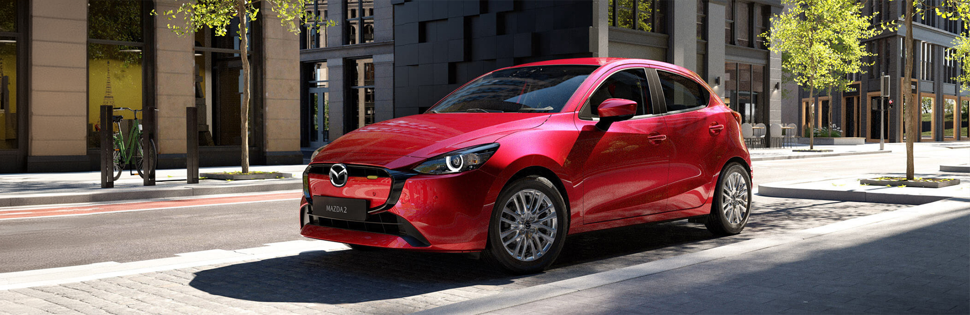 Mazda 2 sports car parked.
