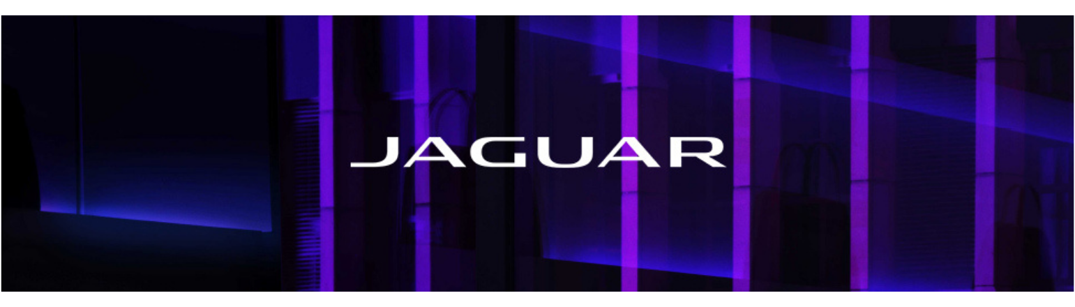 Jaguar branding displayed against modern illuminated backdrop.