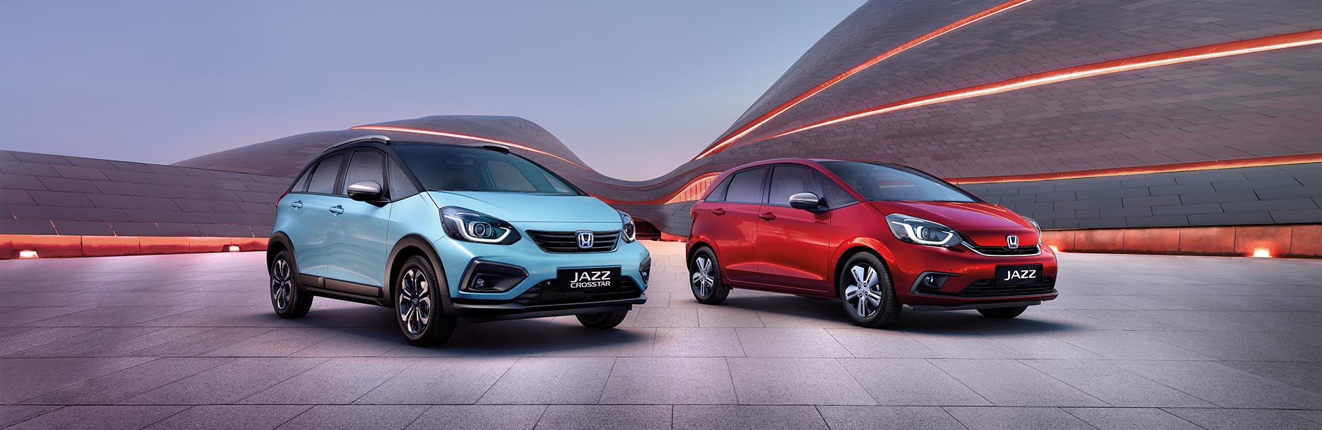 Blue and Red Honda Jazz's
