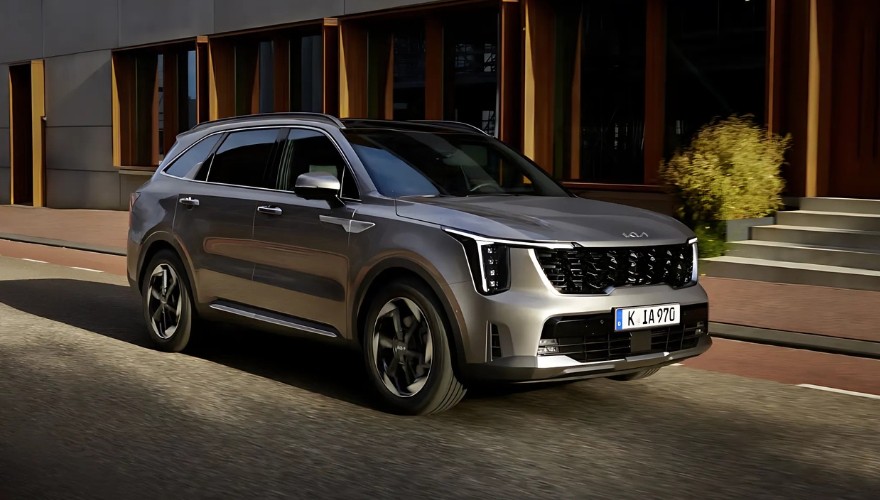 Kia Sorento in grey parked outside a modern building