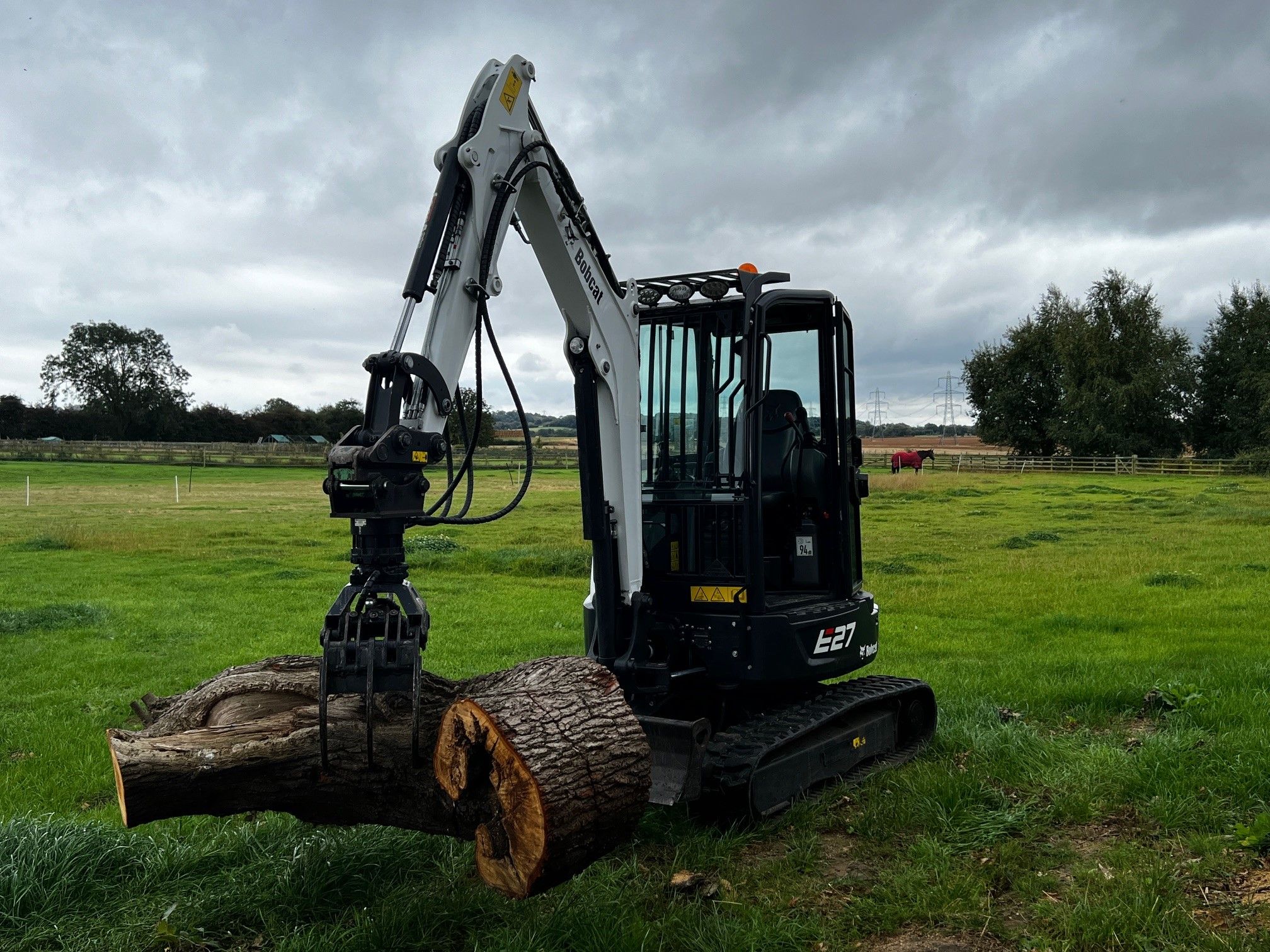 Construction Machine Moving Logs