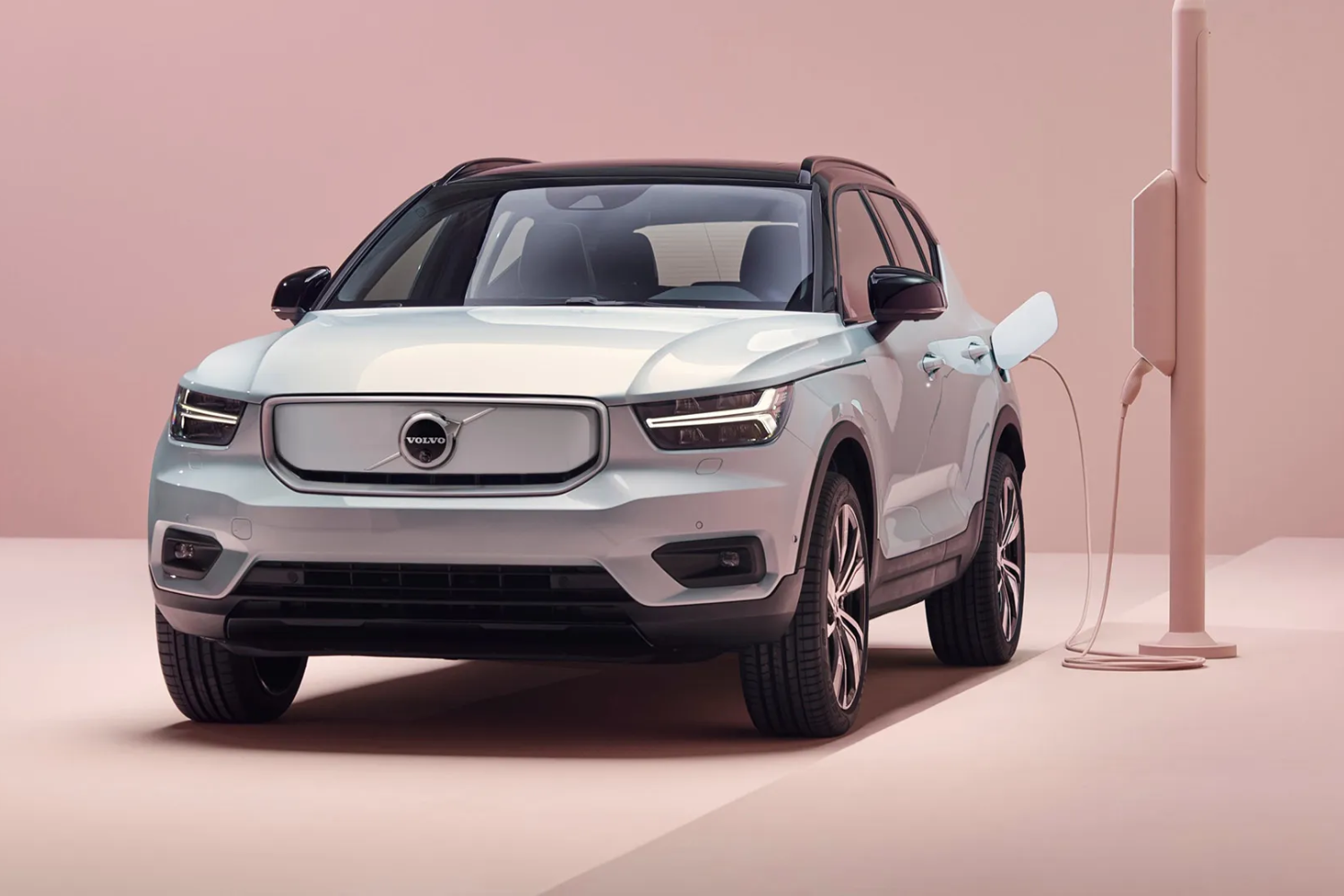 Volvo electric SUV charging at home wall unit.