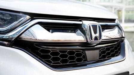 Front grille of a silver Honda CR-V Hybrid.