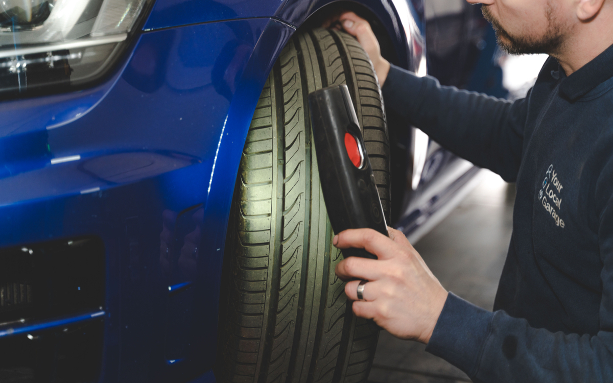 Wheels being aligned on car