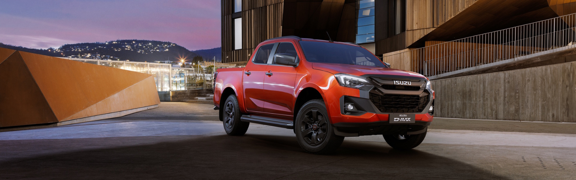 red Isuzu D-Max V-Cross parked