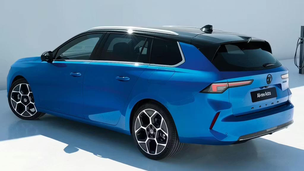 Rear three-quarter view of a blue Vauxhall Astra Sports Tourer showcasing its LED tail lights and estate design.