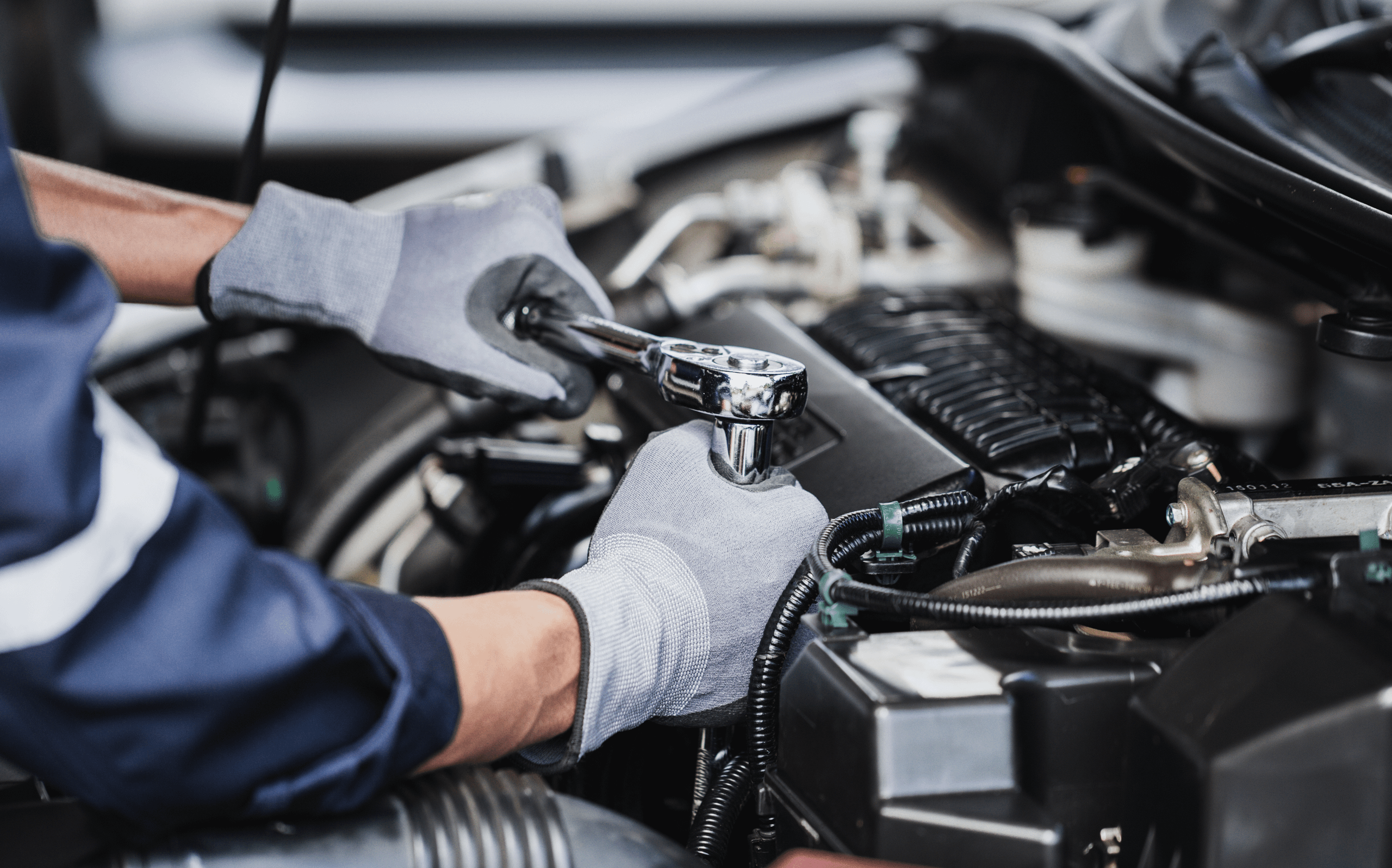 Mechanic fixing an engine