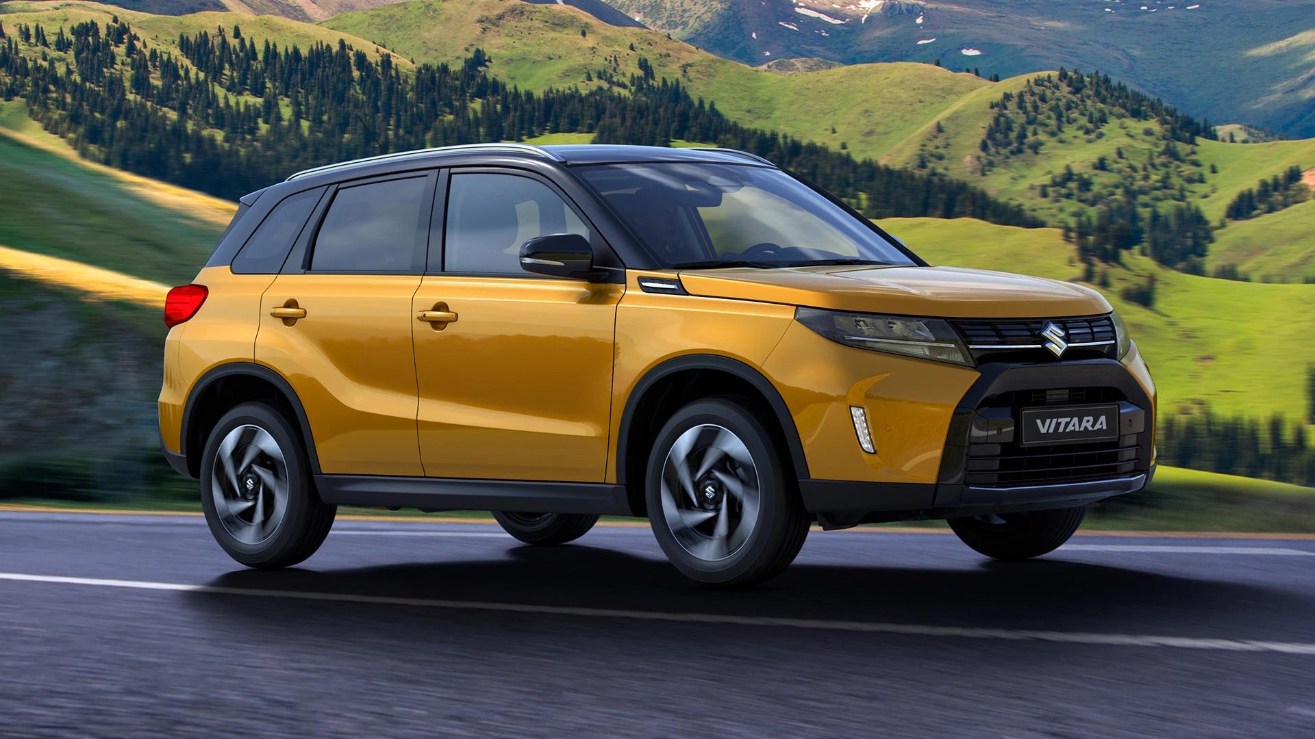 Yellow Suzuki Vitara SUV driving on a mountain road, shown in side profile.