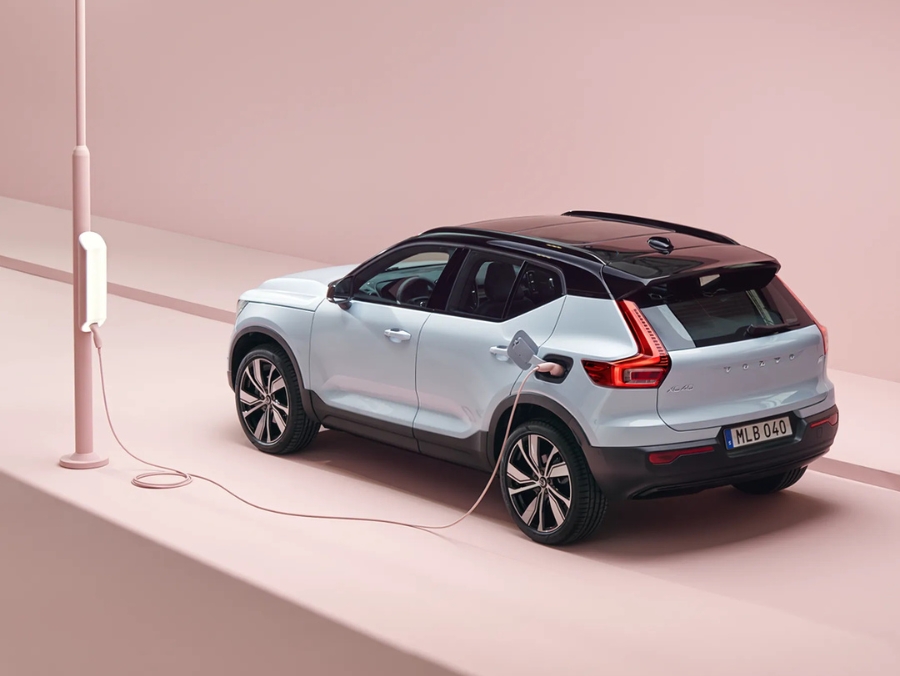 Volvo car charging in a studio background