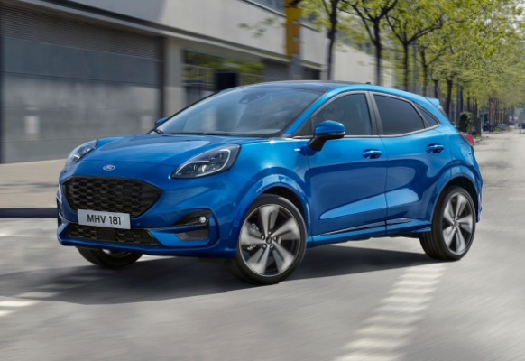 Blue Ford Car turning a corner.