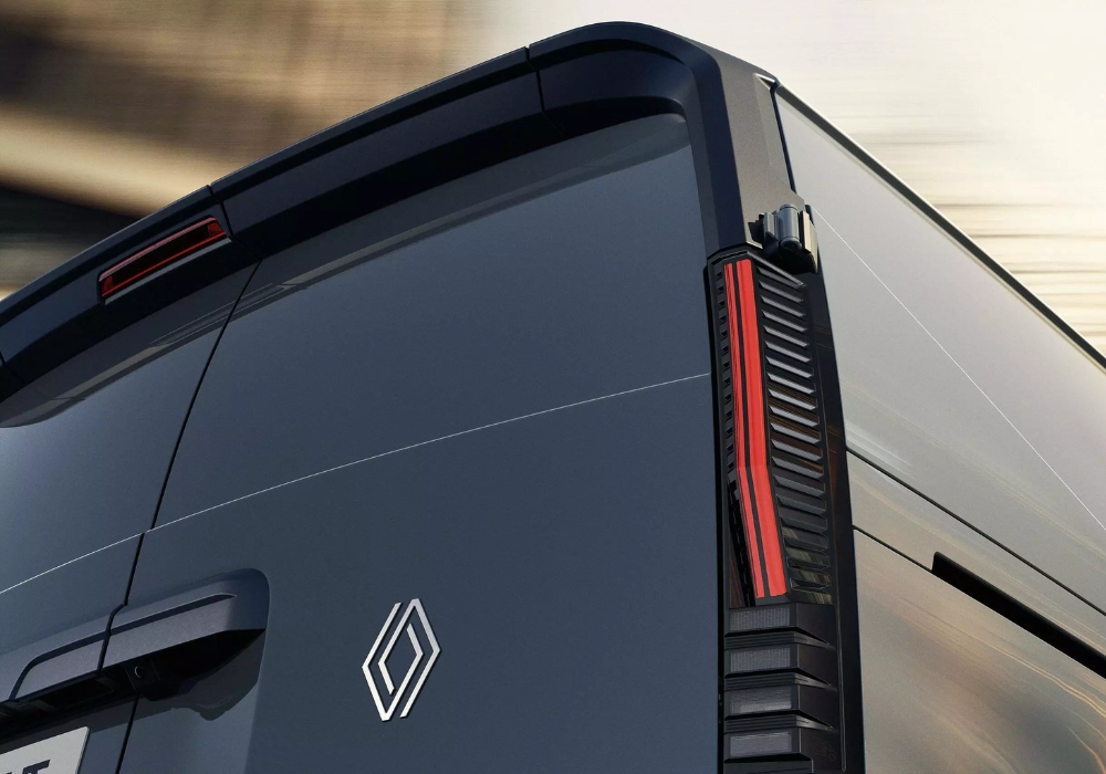 Rear exterior close-up of Renault Trafic E-Tech Electric van highlighting vertical LED tail light design and rear panel styling.