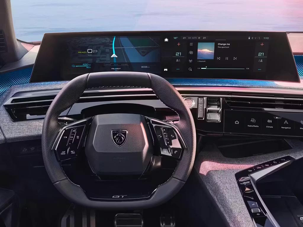 Peugeot E-3008 interior featuring the panoramic Peugeot i-Cockpit, GT steering wheel, curved digital display and advanced connected technology.