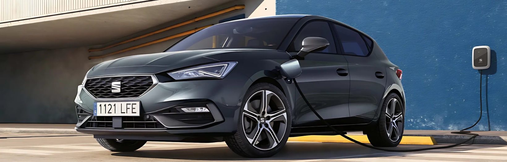 SEAT Leon e-hybird plugged into a charger on a blue