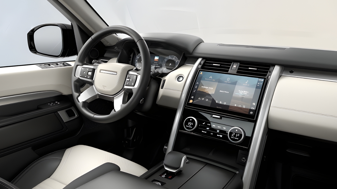 Land Rover Discovery Tempest interior with steering wheel, digital driver display and central touchscreen infotainment system.