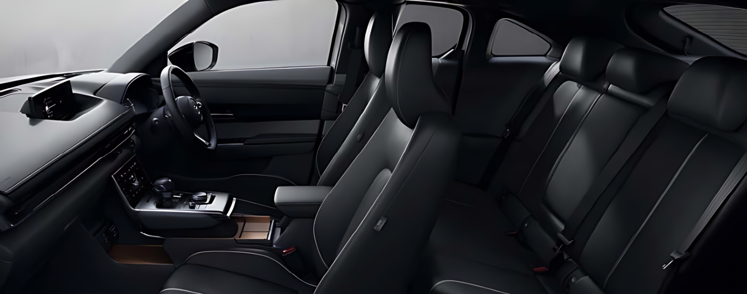 Mazda CX-30 cabin captured from the side highlighting driver and passenger area.